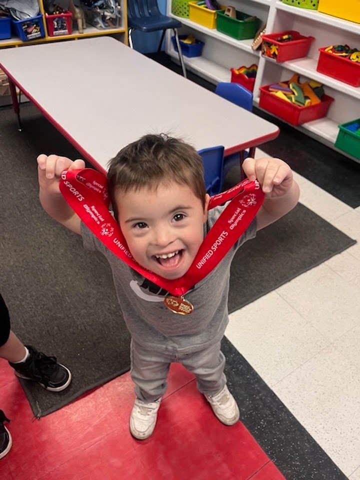 Five children standing in doorway with