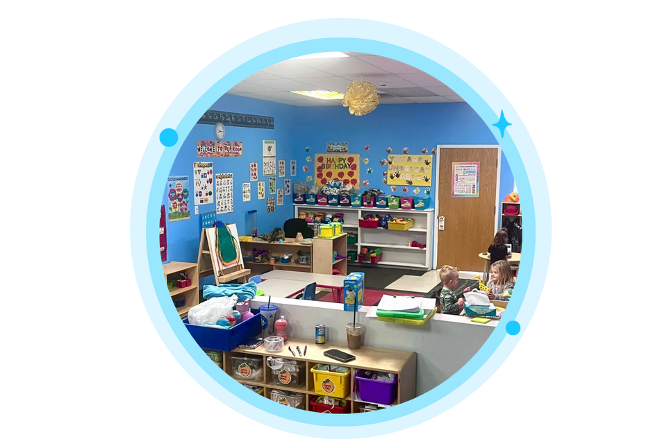Childcare classroom, blue walls, toys, art supplies, and furniture.