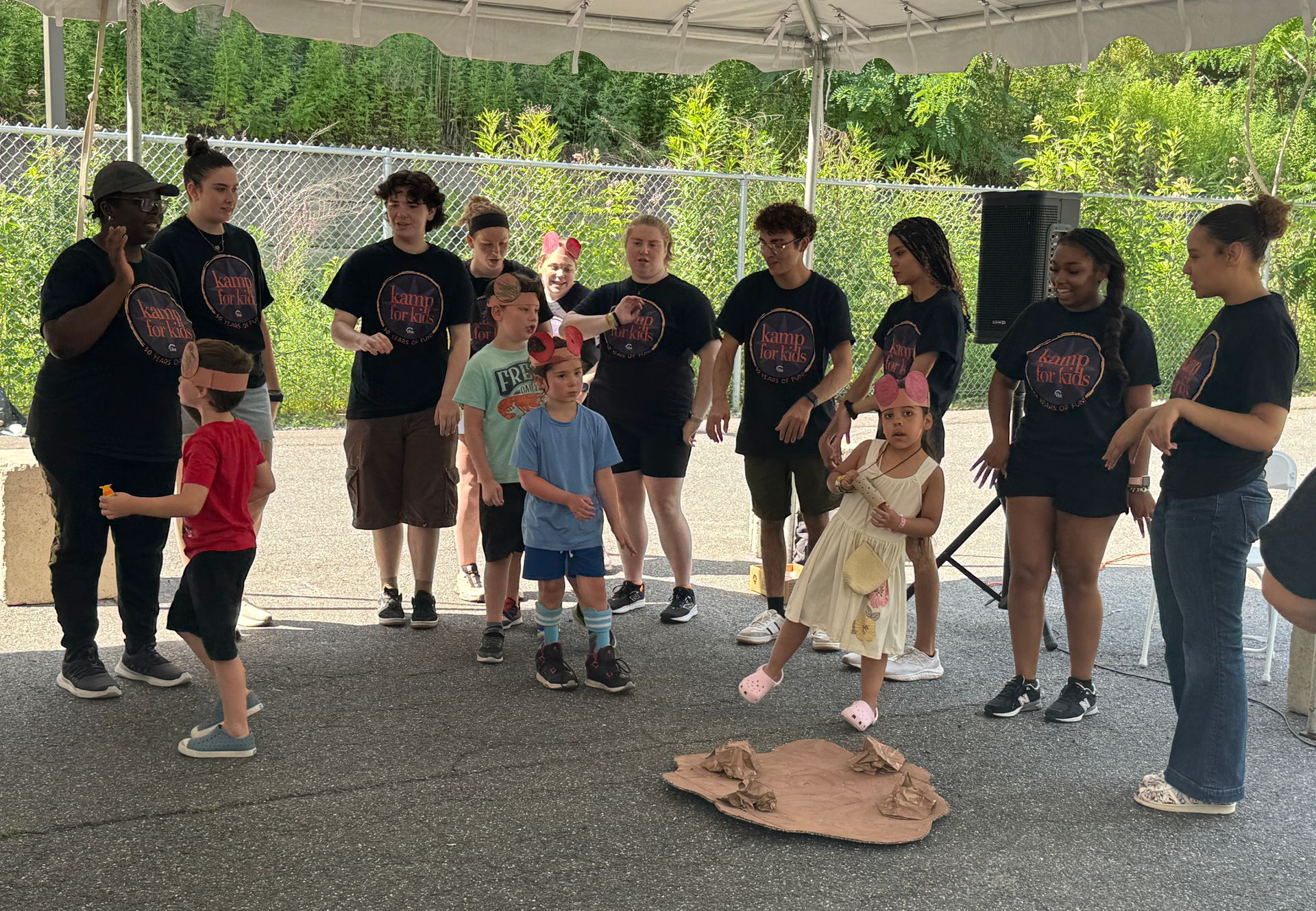 Kamp counselors and campers performing together at Kamp Welcome Day.