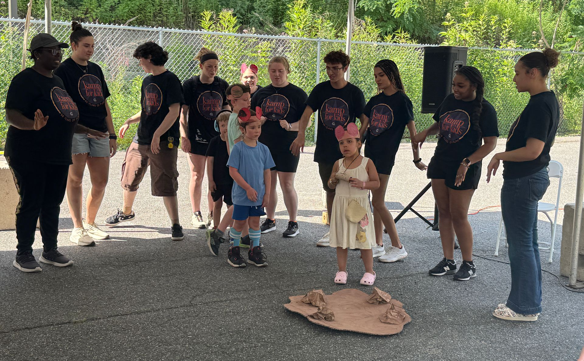 Kamp counselors and campers performing together at Kamp Welcome Day.