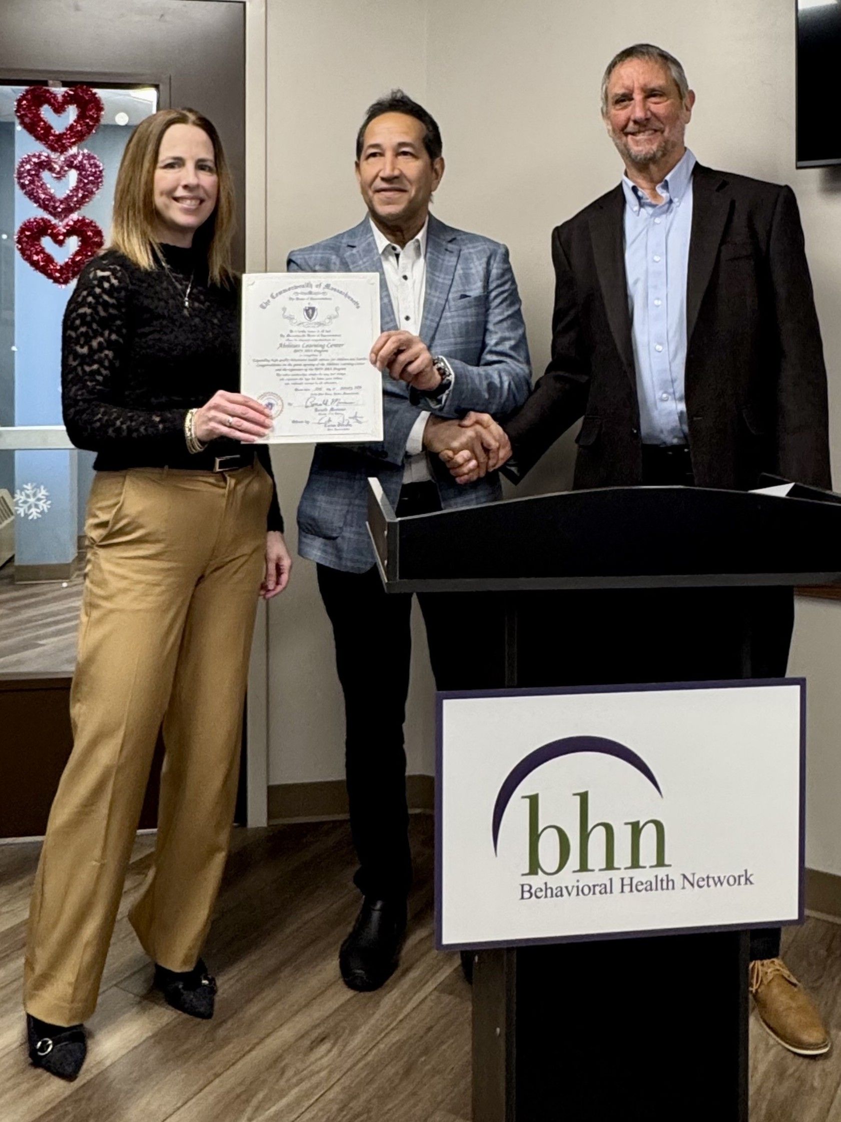 Program staff and local officials mark the grand opening of the Abilities Learning Center in Springfield.