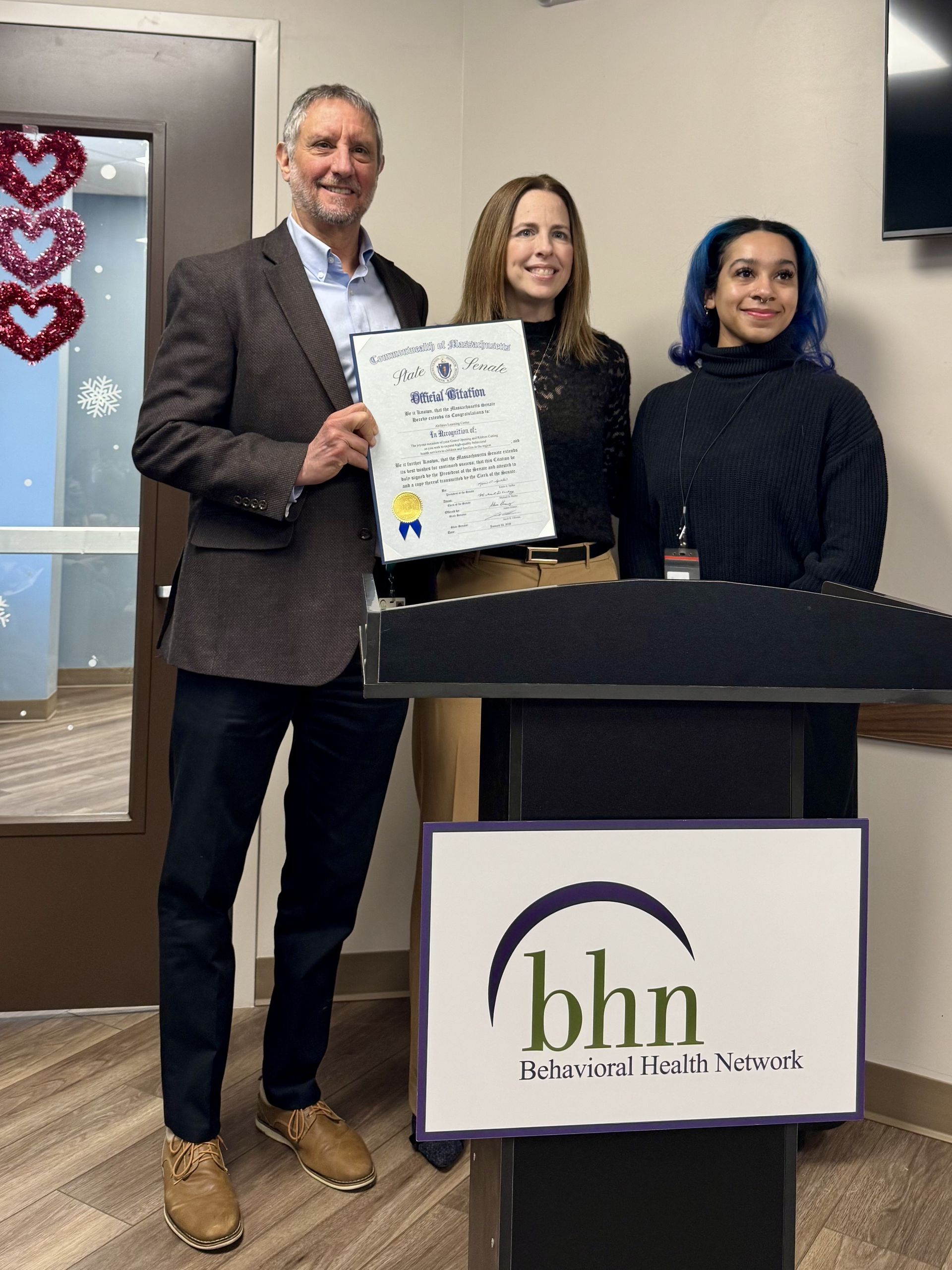 Program staff and local officials mark the grand opening of the Abilities Learning Center in Springfield.