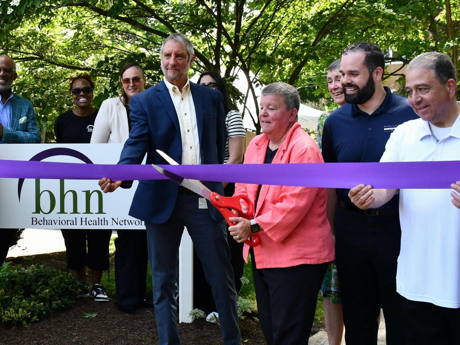 Steve Winn, Rose Evans, Enrique J. Pepén, and Rob Consalvo cut a ribbon for the Rose's House opening