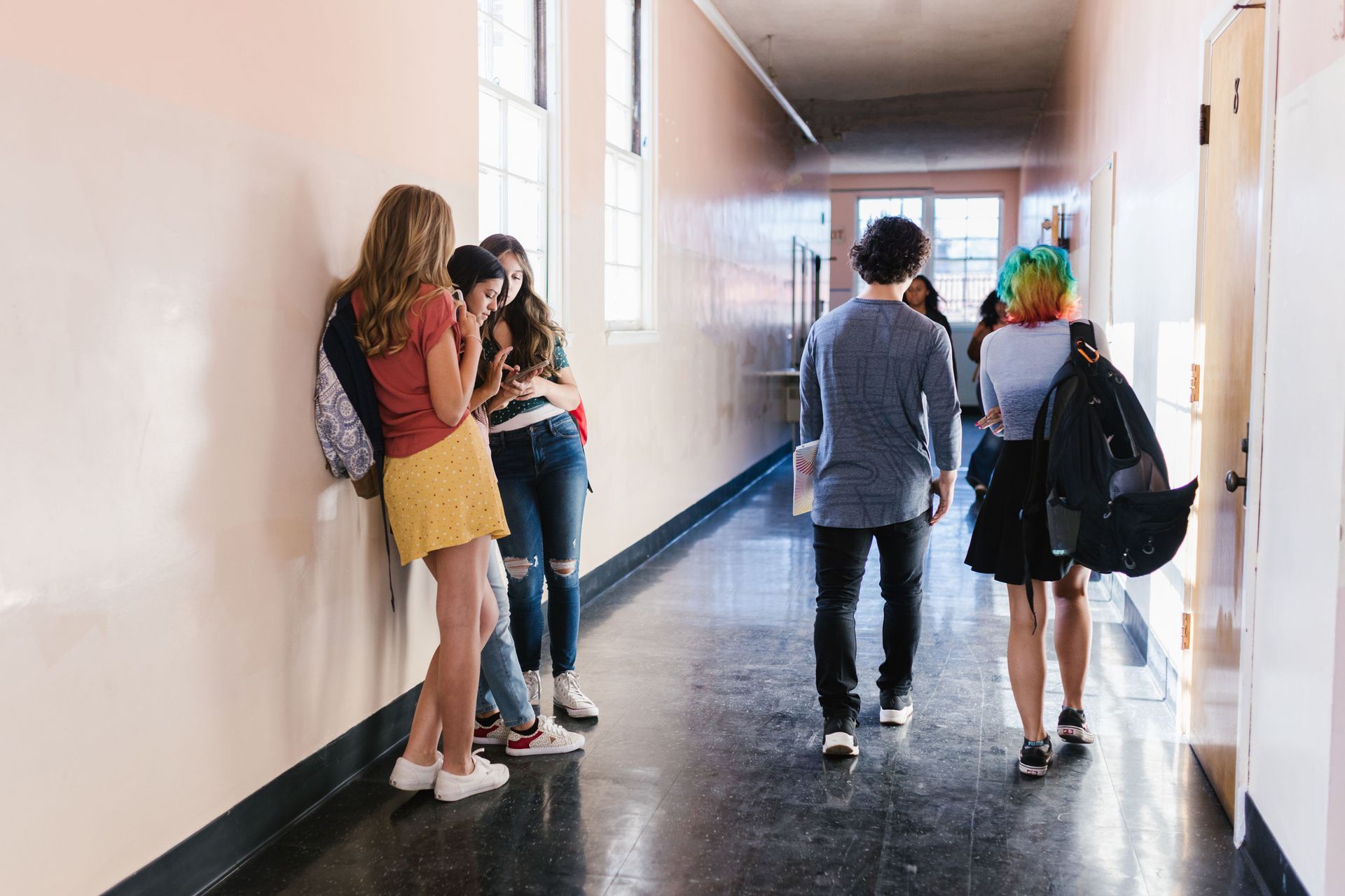 High school students hanging out in the hallway