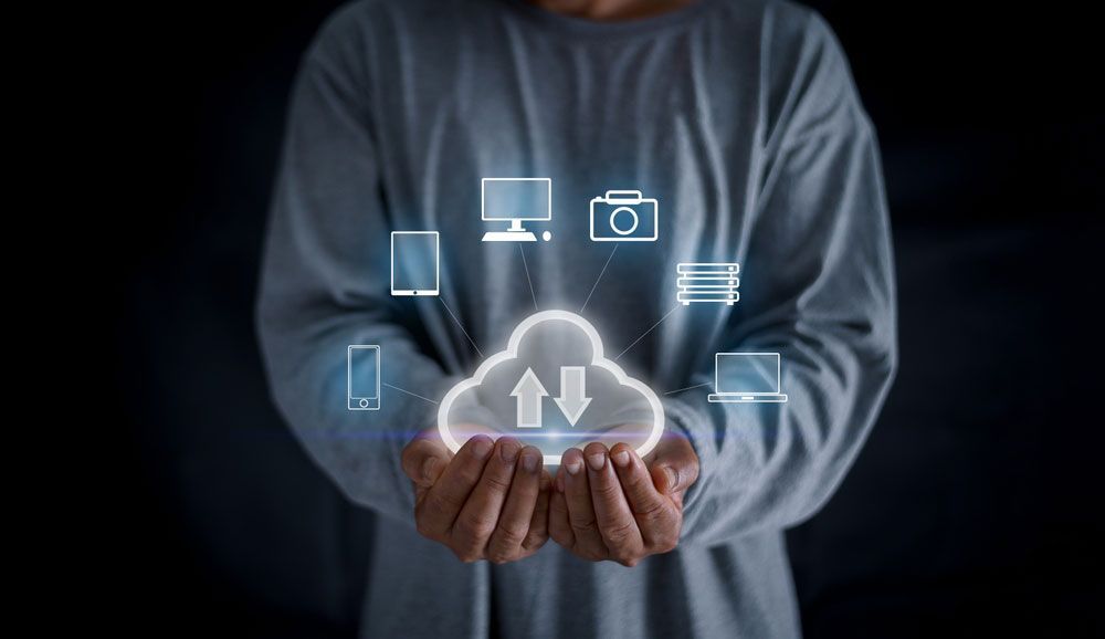 Man Holding a Hologram of a Cloud System Concept — Communication Systems in Newcastle, NSW