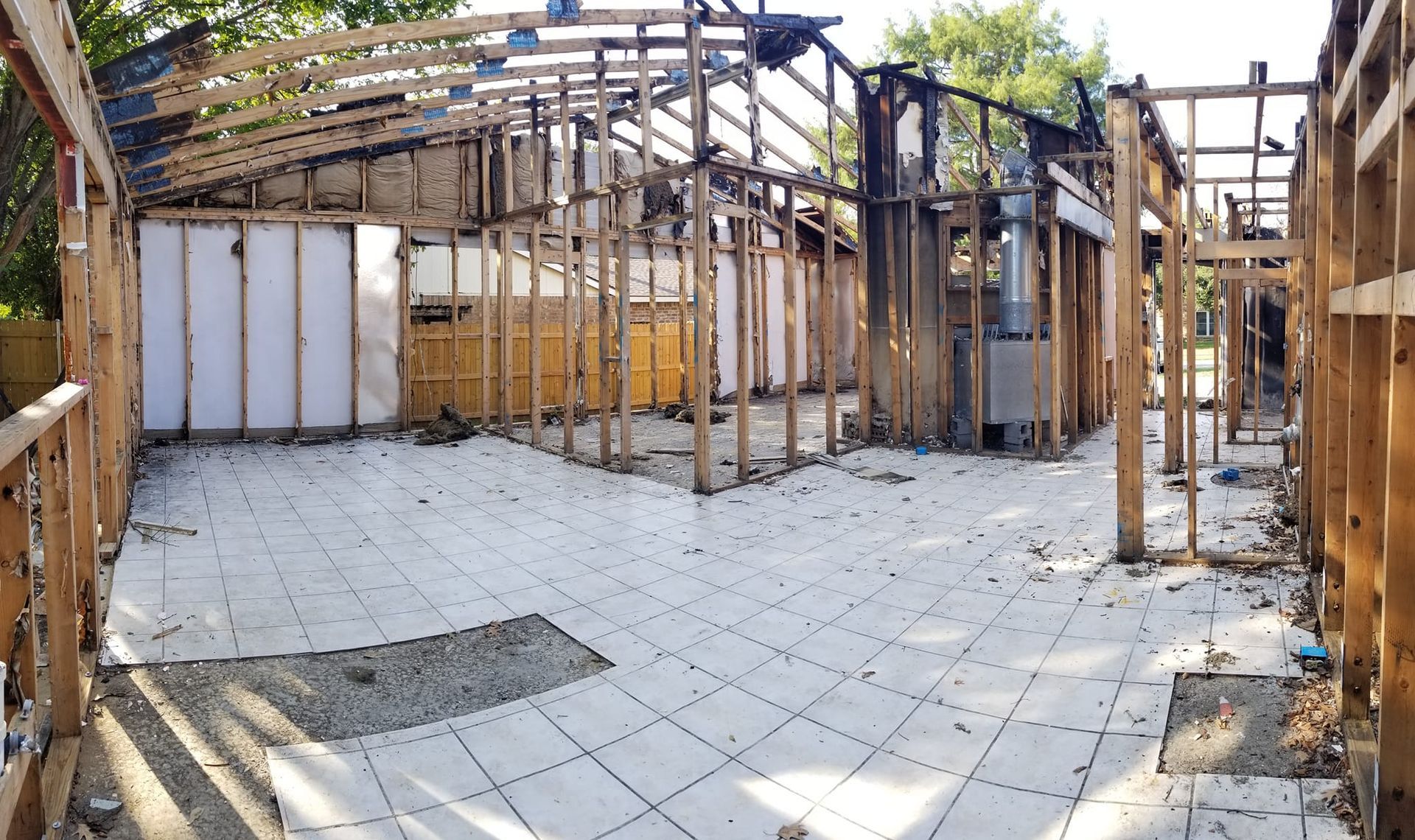 The inside of a building under construction with a tiled floor