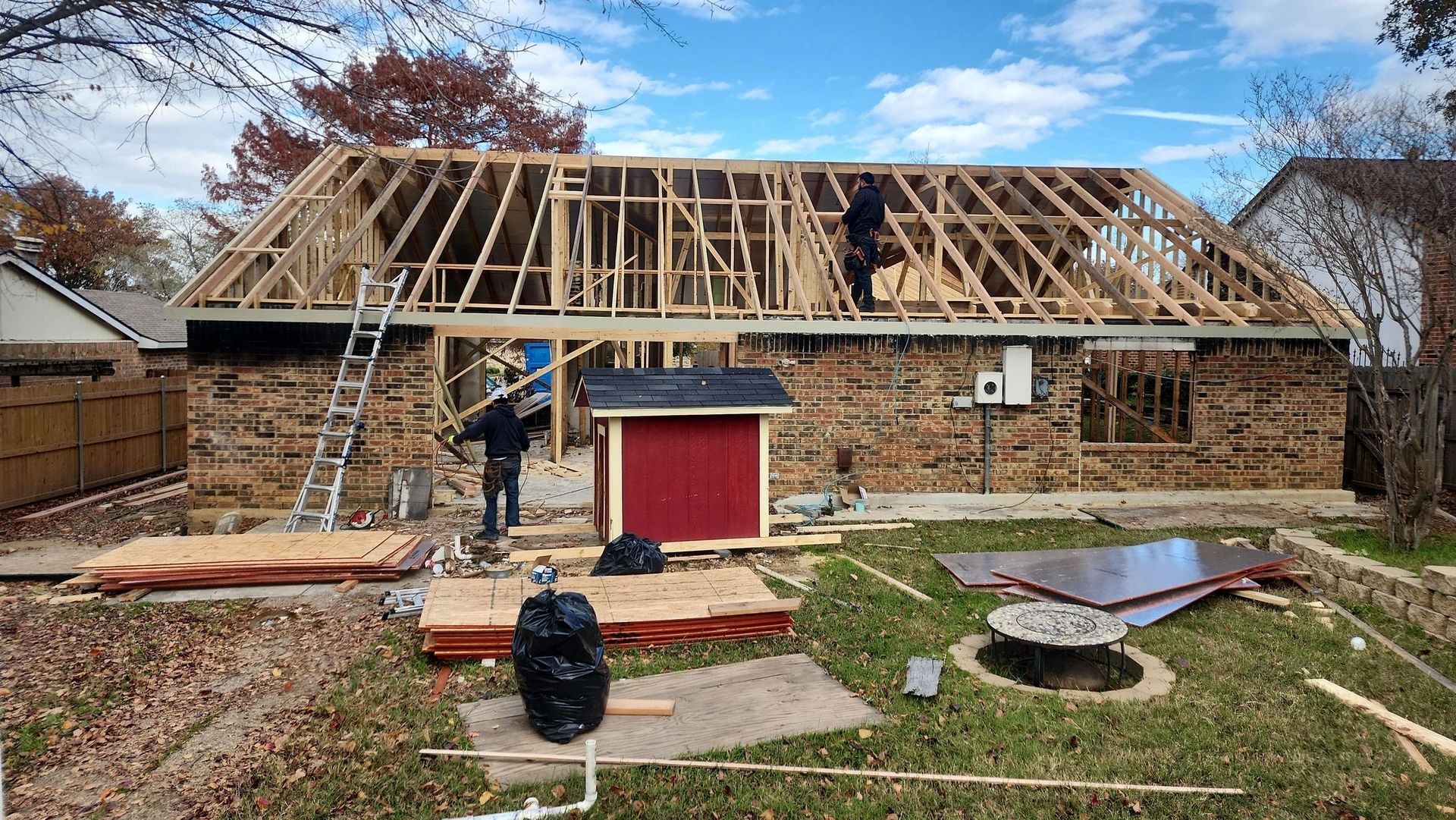 A house is being built with a roof that is being built.
