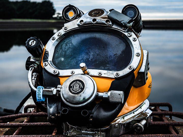 diving helmet on metal grate