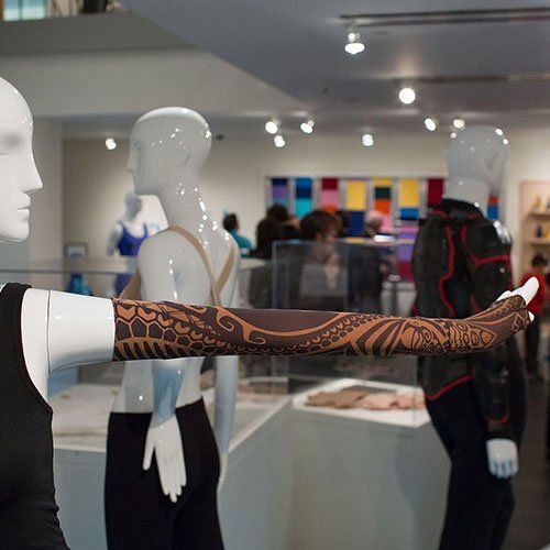 A mannequin with a tattoo on her arm