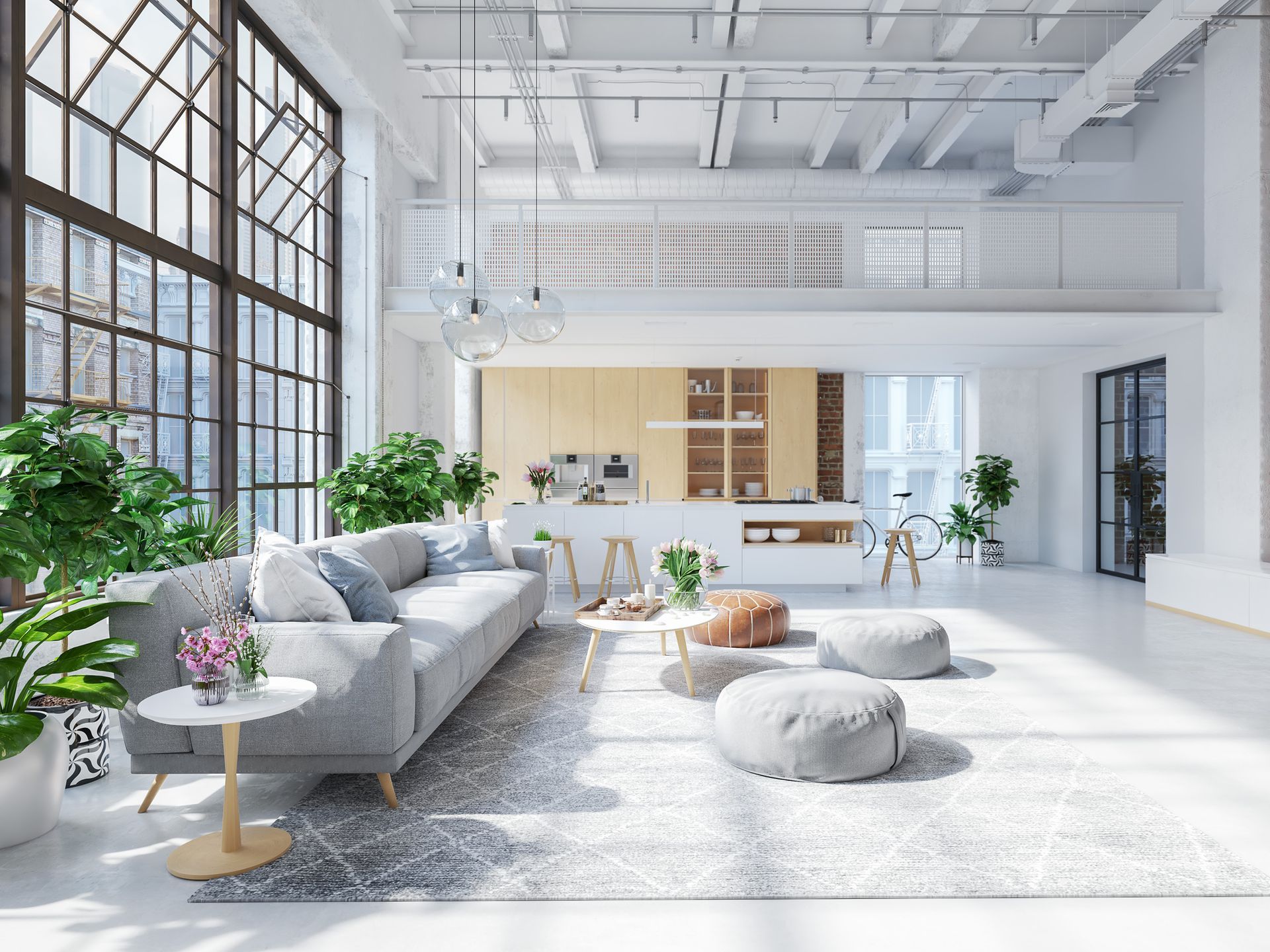 Bright, modern loft interior with large windows and kitchen.