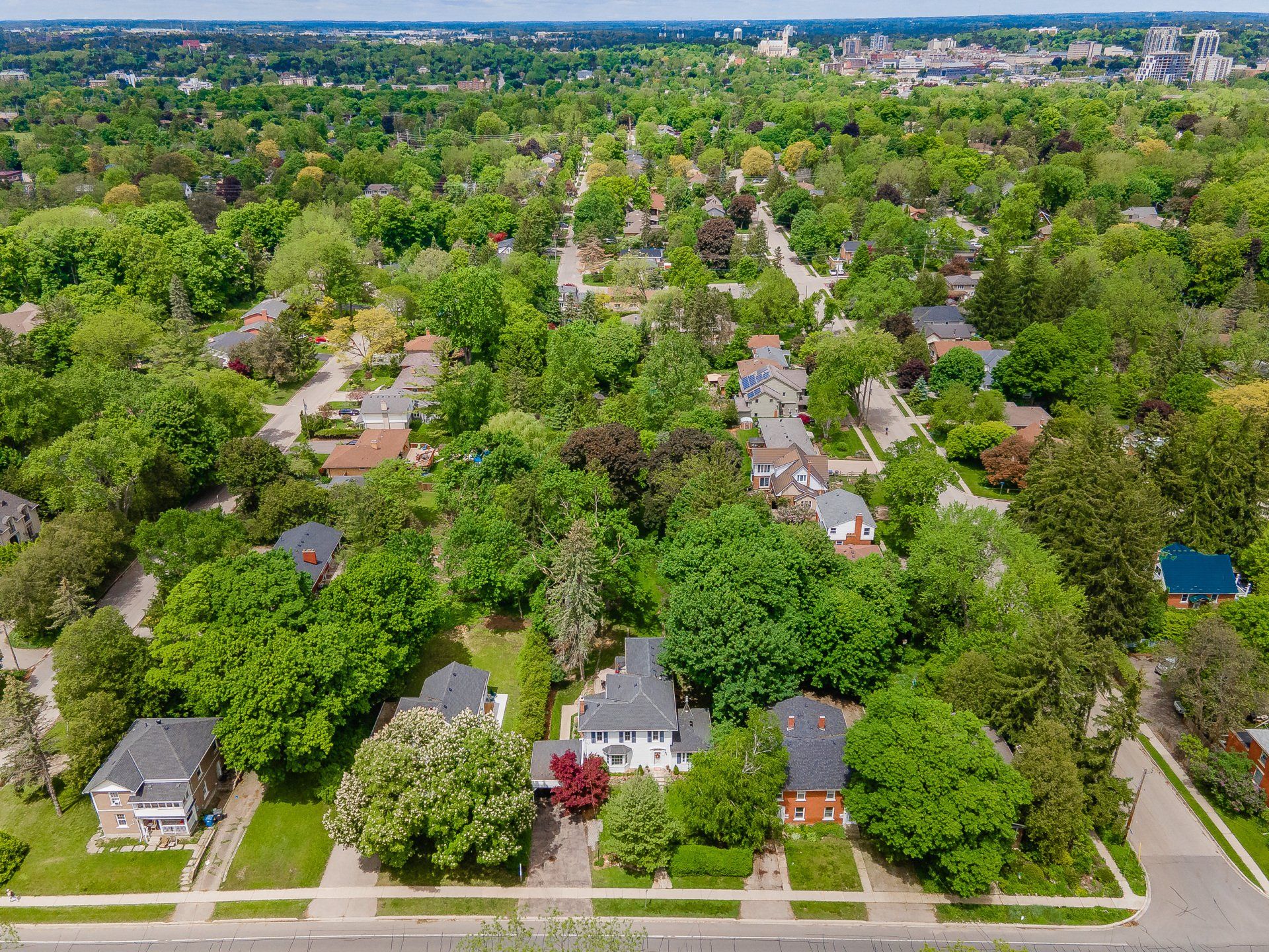 An aerial view of a residential area filled with lots of trees and houses.