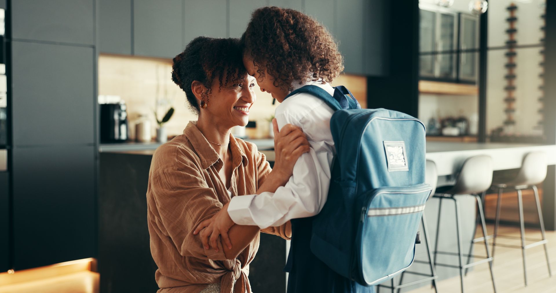 A mother prepares her child for their first day at a new school in Guelph