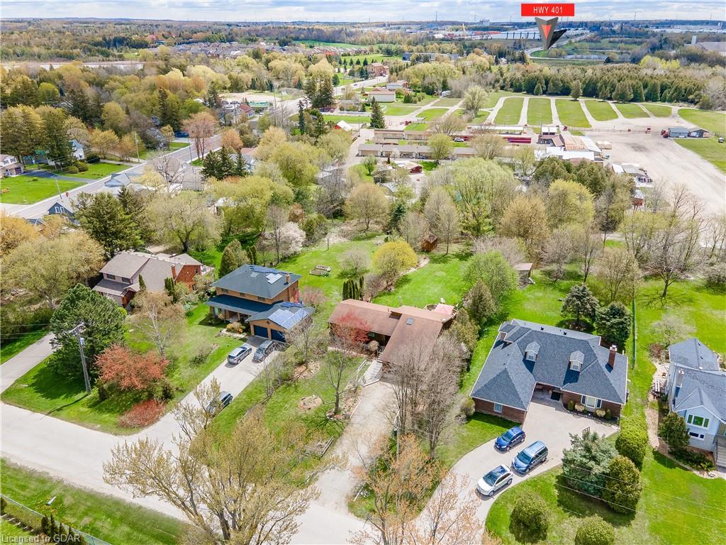 An aerial view of a residential area with lots of houses and trees.