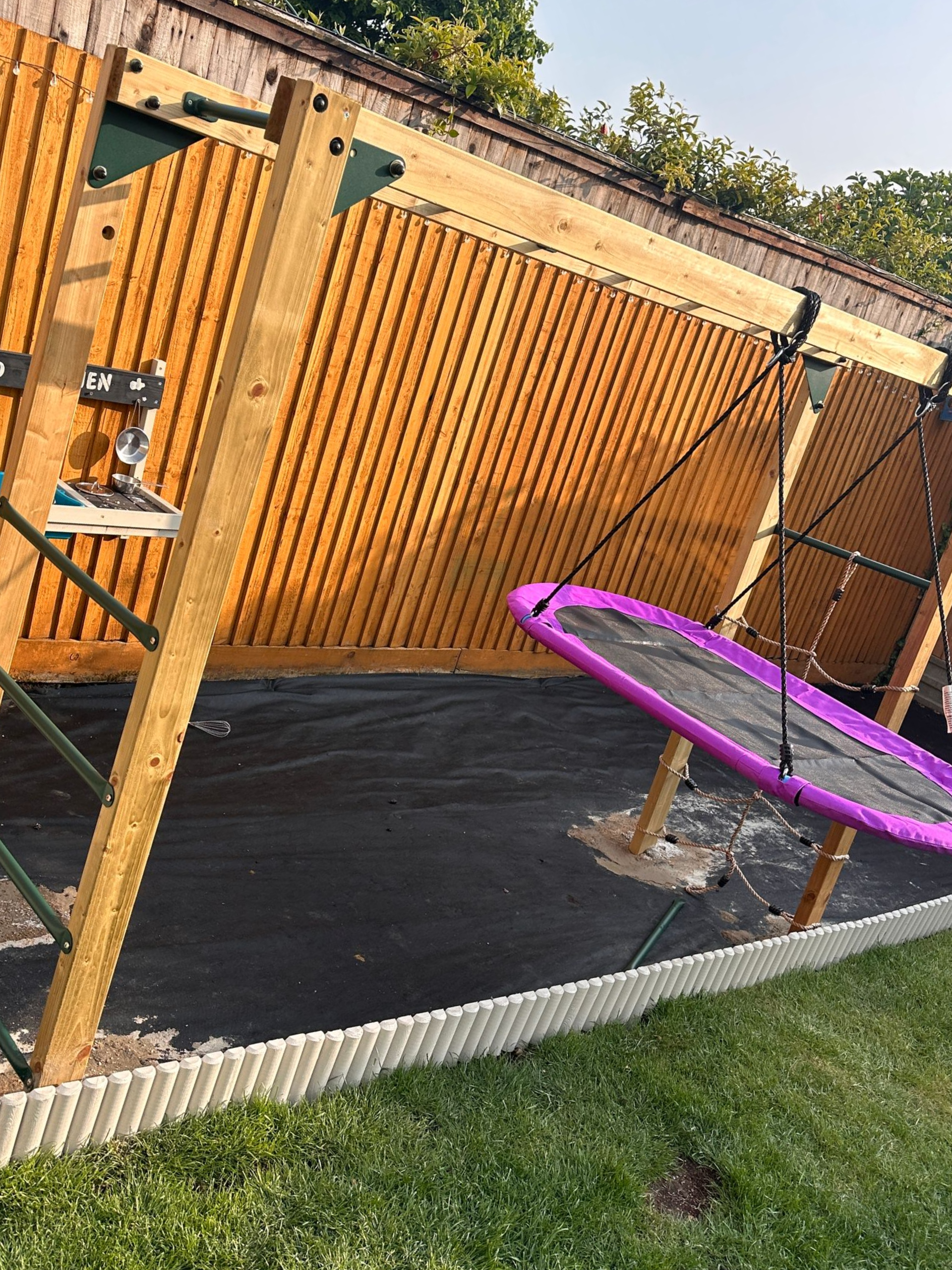 Monkey bars assembled and secured into the ground