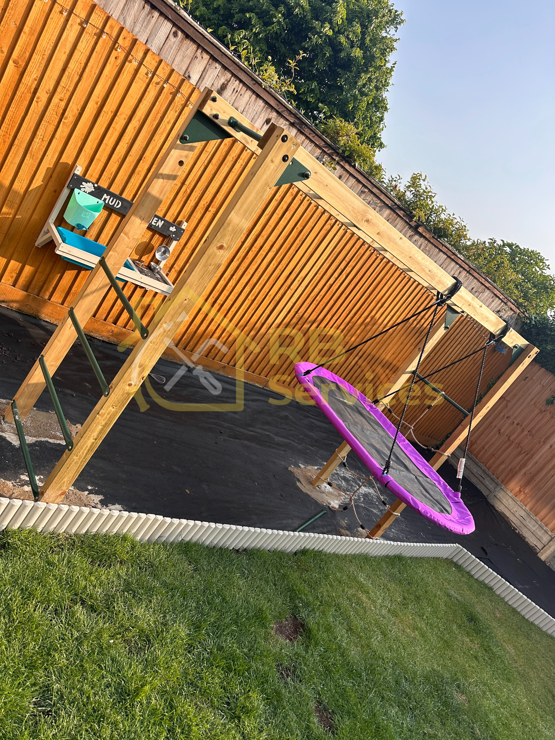 Monkey bars assembled and secured into the ground