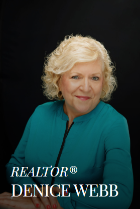 Denice Webb, Realtor, poses with a smile in a teal top. Black background.