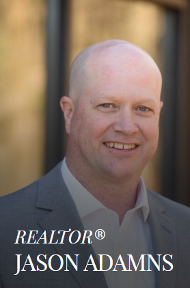 Jason Adams, Realtor, smiling, wearing a gray suit jacket and white shirt.