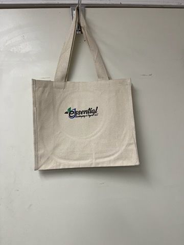 A tan fabric tote bag with a small logo featuring the word 