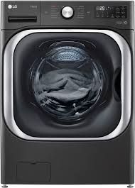 An lg washer and dryer with clothes in it.