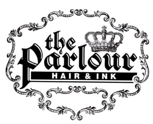 Logo for "the Parlour HAIR & INK," featuring elegant black gothic typography and a crown, enclosed in an ornate frame.