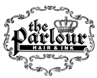 Logo for "the Parlour HAIR & INK," featuring elegant black gothic typography and a crown, enclosed in an ornate frame.