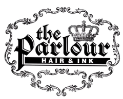 Logo for "the Parlour HAIR & INK," featuring elegant black gothic typography and a crown, enclosed in an ornate frame.