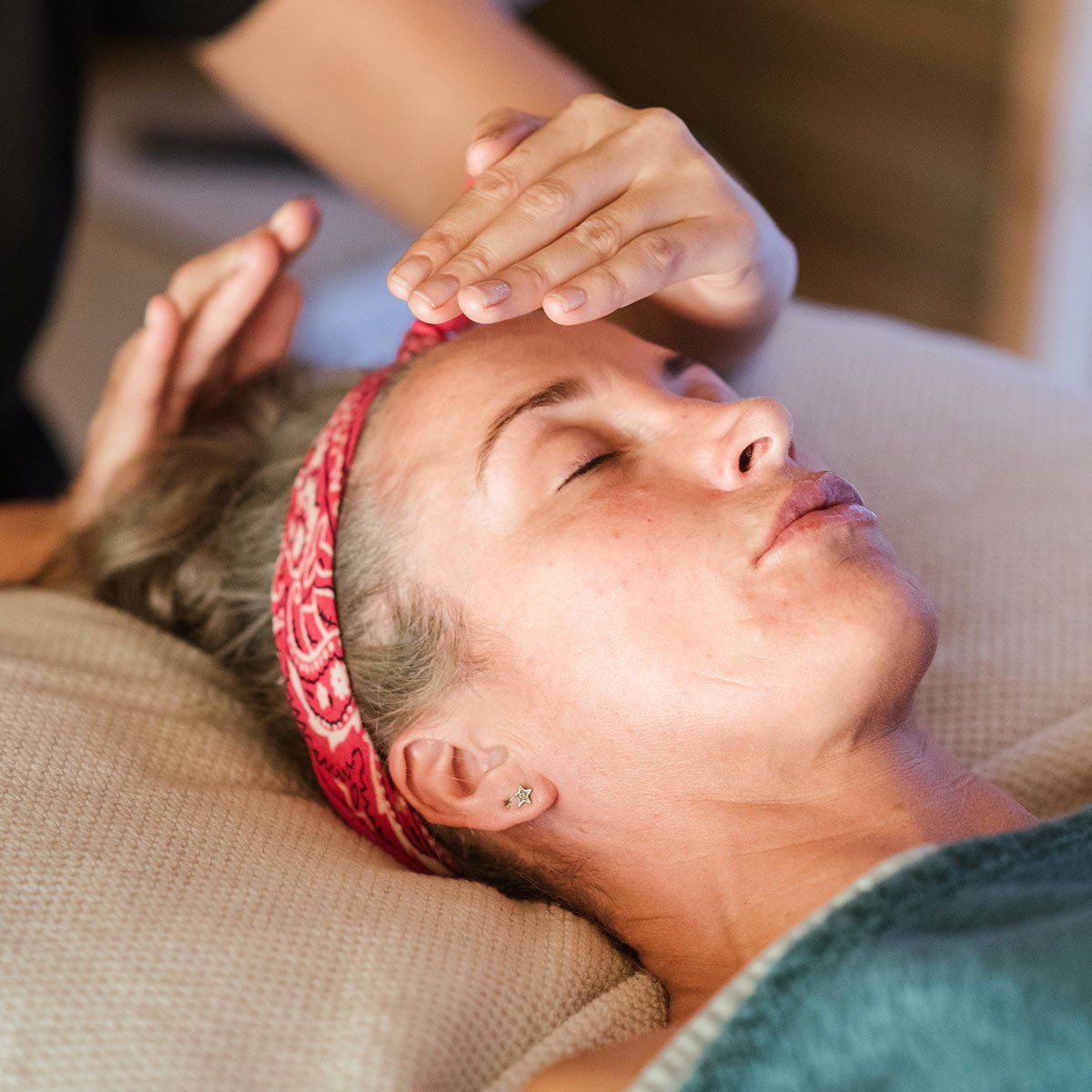 Practitioner performing a Reiki Energy medicine treatment at Health Energies Vaughan Wellness centre