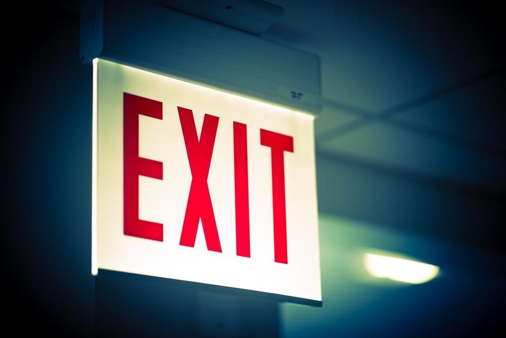 A Red and White Exit Sign Hangs from The Ceiling — Stellar Test and Tag in Narrabri, NSW