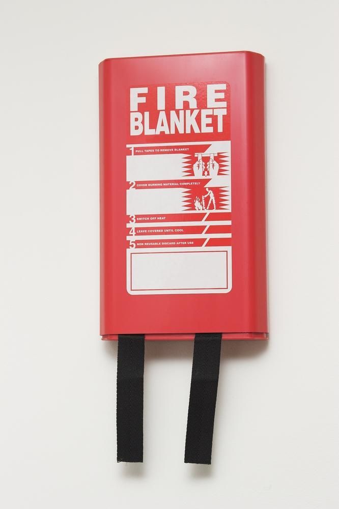 A Red Fire Blanket Is Hanging on A White Wall — Stellar Test and Tag in Gunnedah, NSW