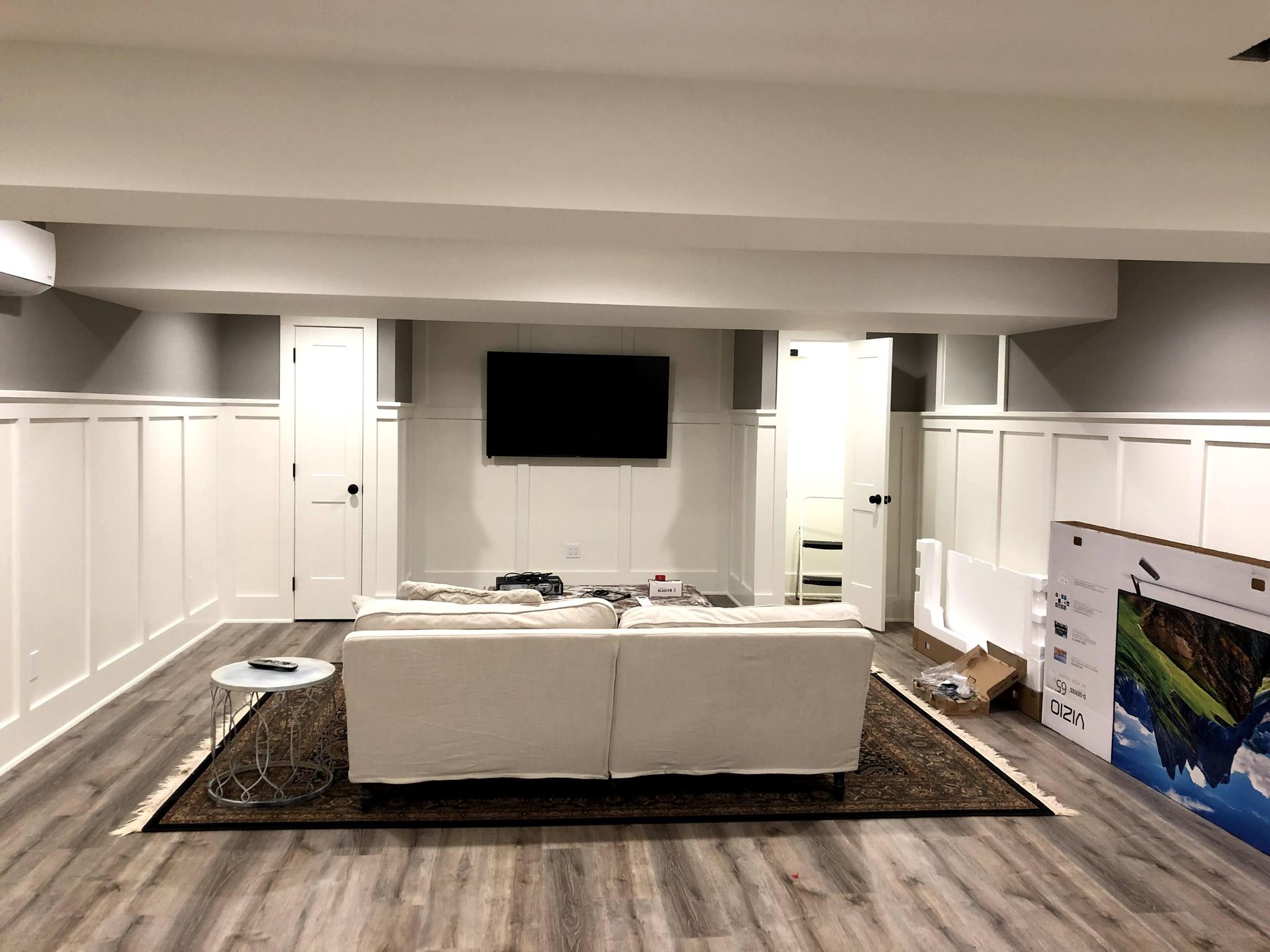 a living room with a box that says xbox on it