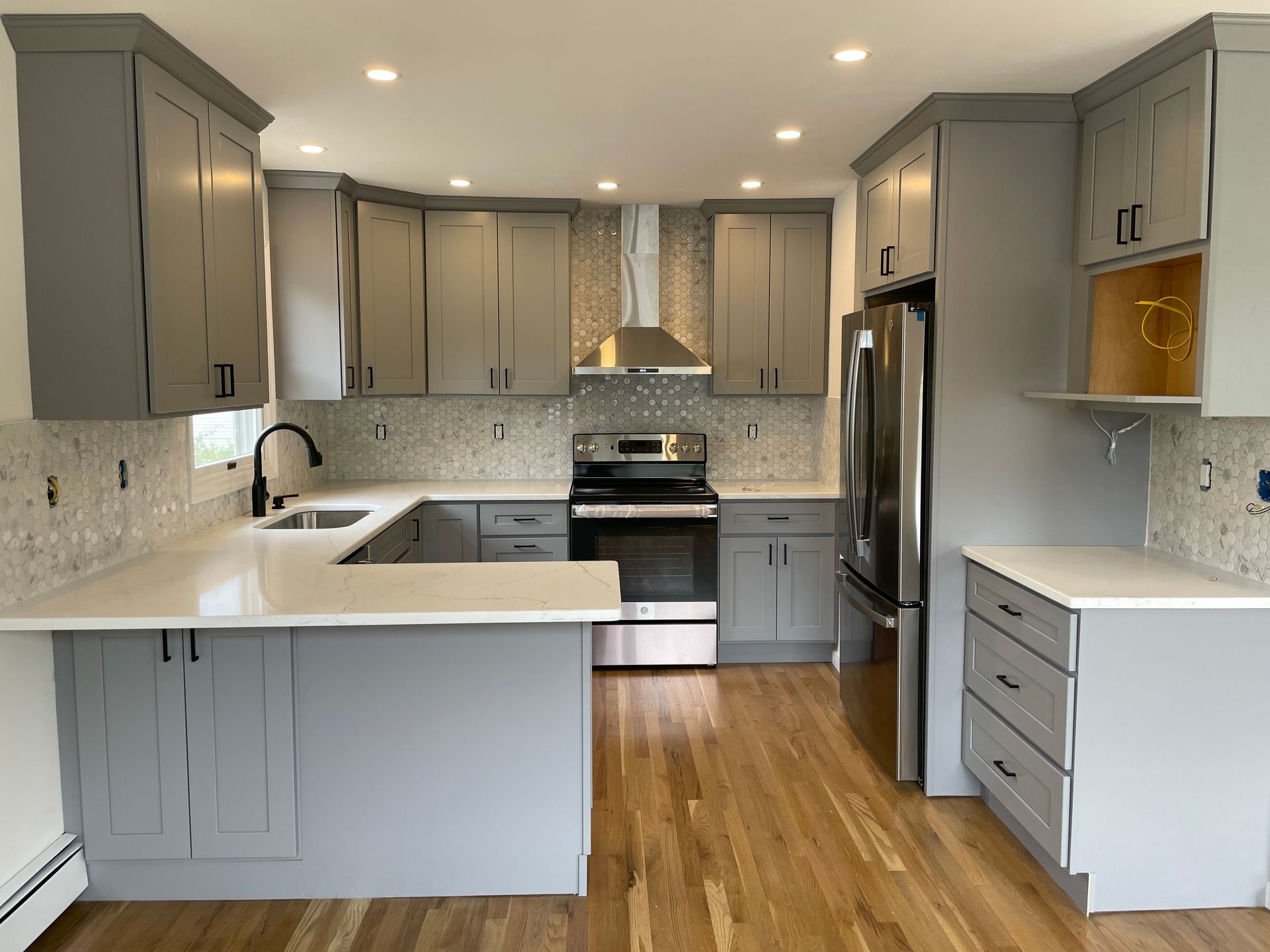 Beautiful lighting and electrical work in a residential home kitchen