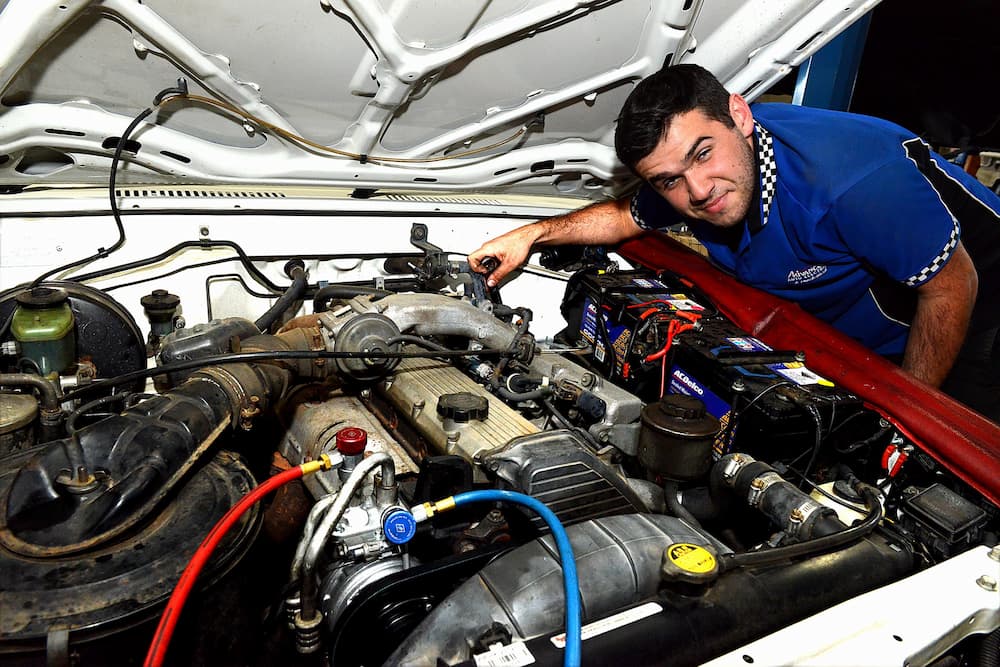 Mechanic Servicing Truck Engine — Advanced Auto Electrics & Mechanical in Innisfail, QLD