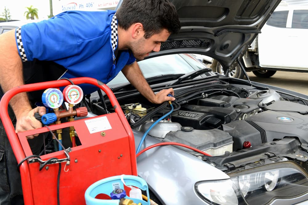 Auto Electrician checking Battery Voltage — Advanced Auto Electrics & Mechanical in Innisfail, QLD