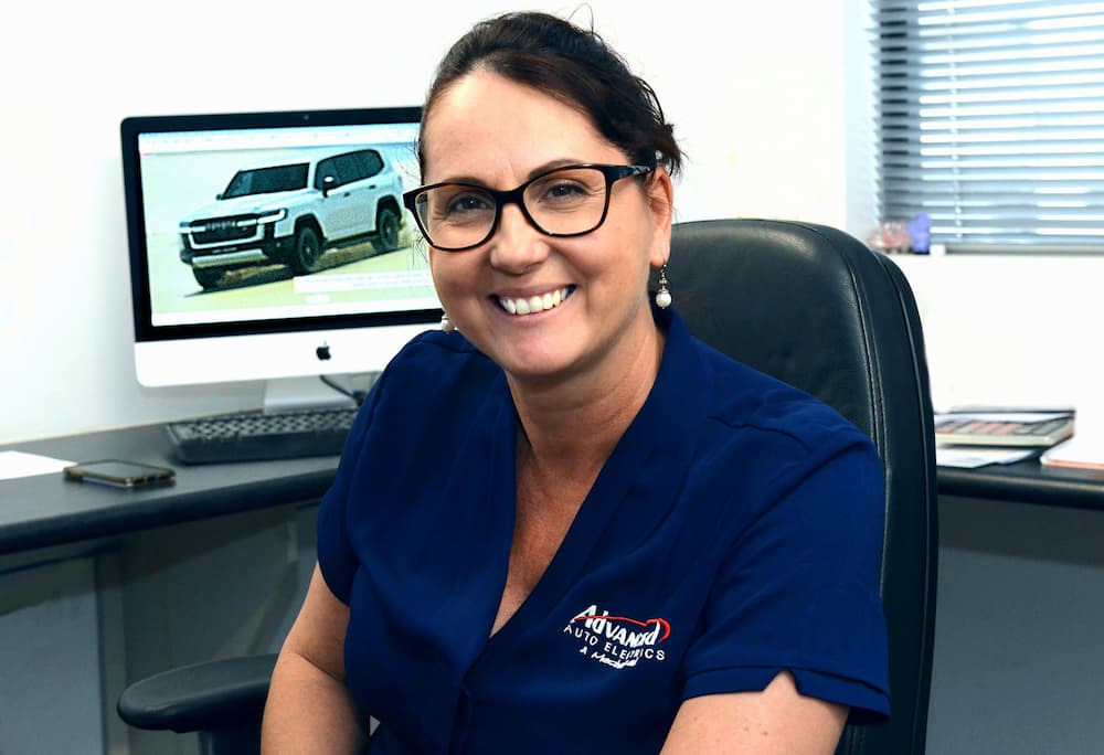 Smiling Woman Wearing Uniform — Advanced Auto Electrics & Mechanical in Innisfail, QLD
