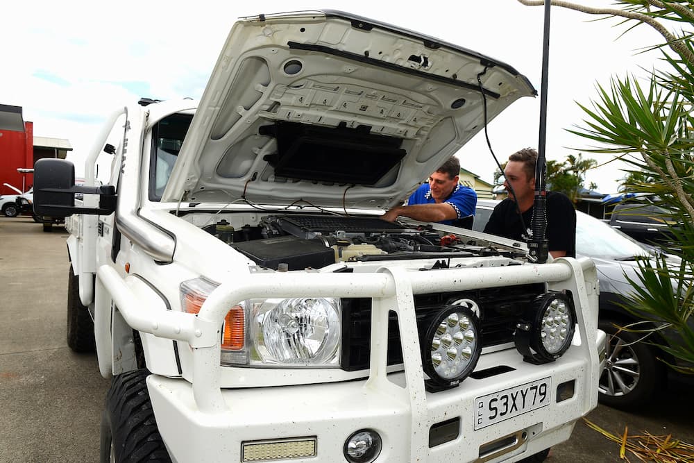 Auto Mechanic Checking Truck's Engine — Advanced Auto Electrics & Mechanical in Innisfail, QLD
