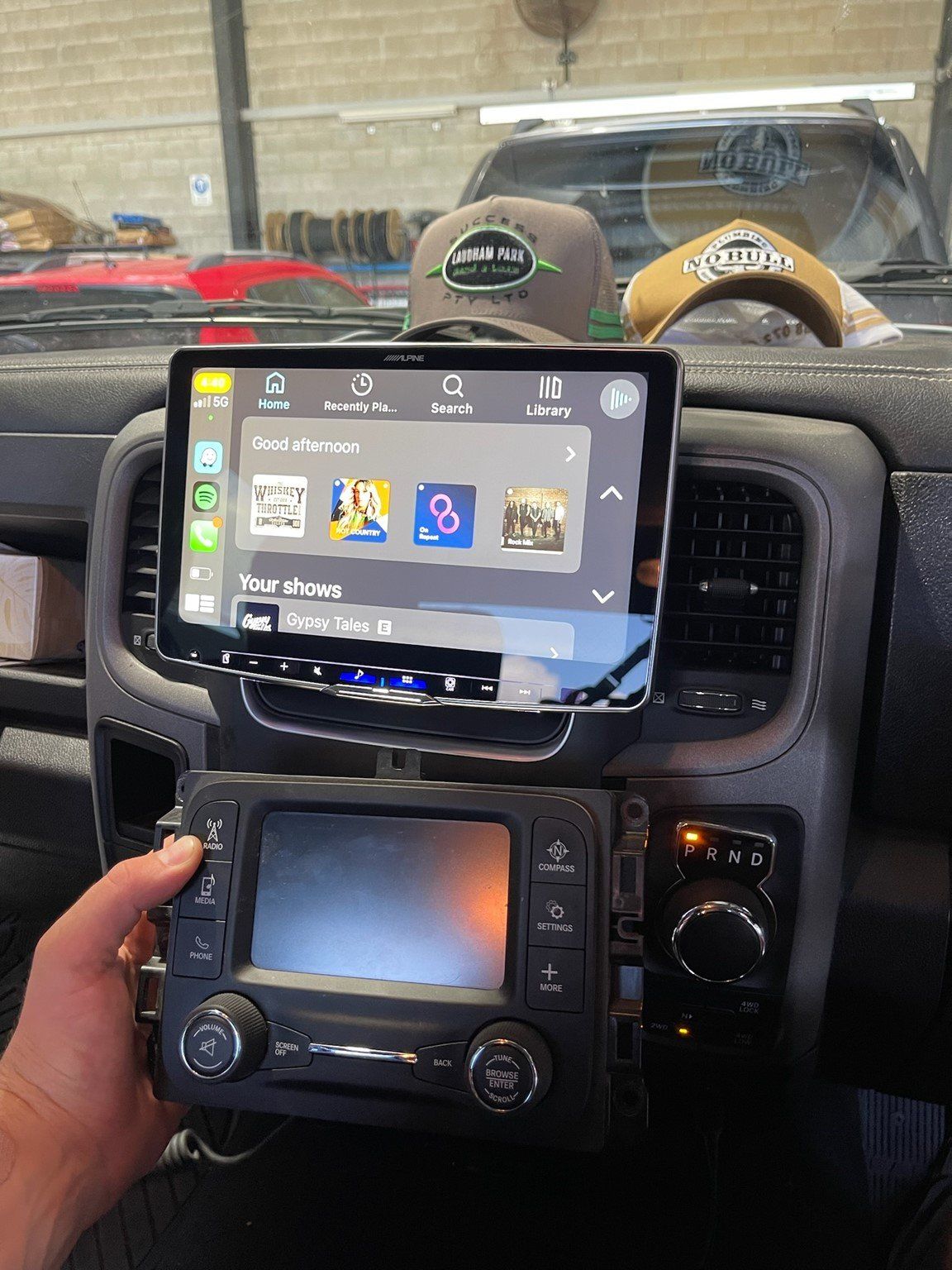 Mechanic Removing Car Battery — Advanced Auto Electrics & Mechanical in Innisfail, QLD