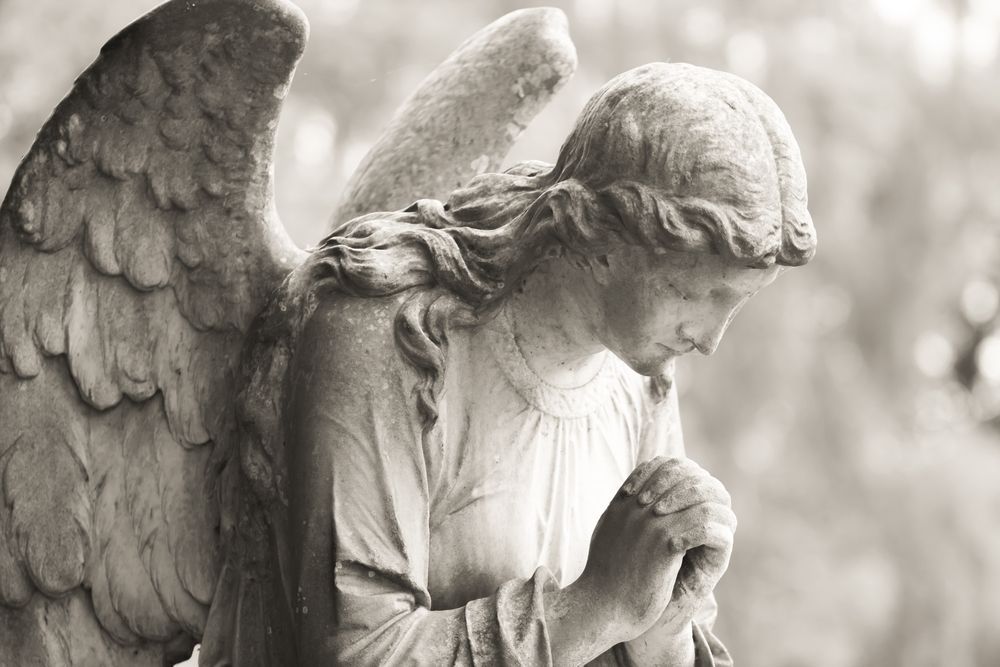 A Black and White Photo of a Statue of an Angel Praying — Angel of Light Nick Turner In East Lismore, NSW