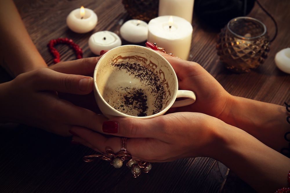 A Woman is Holding a Cup of Coffee in Her Hands — Angel of Light Nick Turner In East Lismore, NSW
