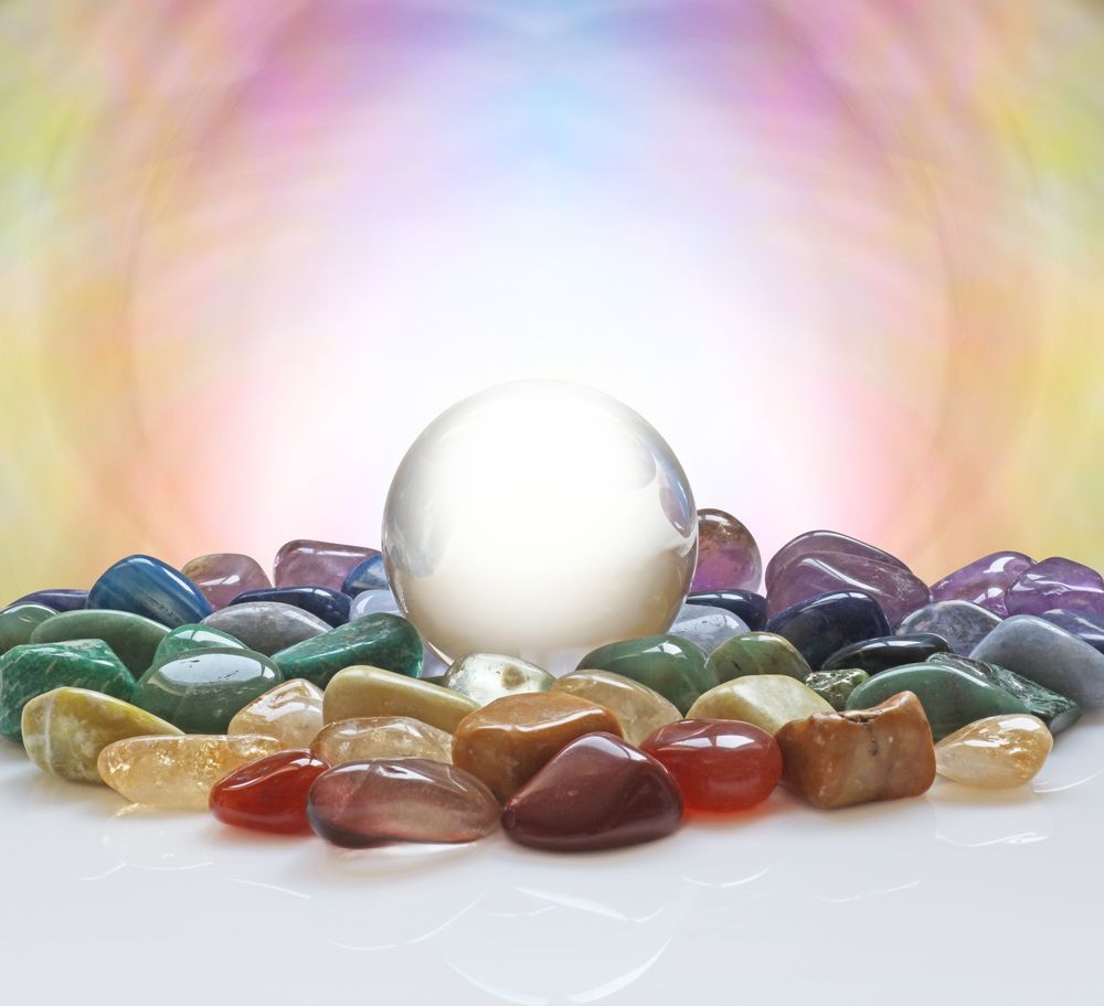 A Crystal Ball is Sitting on Top of a Pile of Rocks — Angel of Light Nick Turner In Byron Bay, NSW