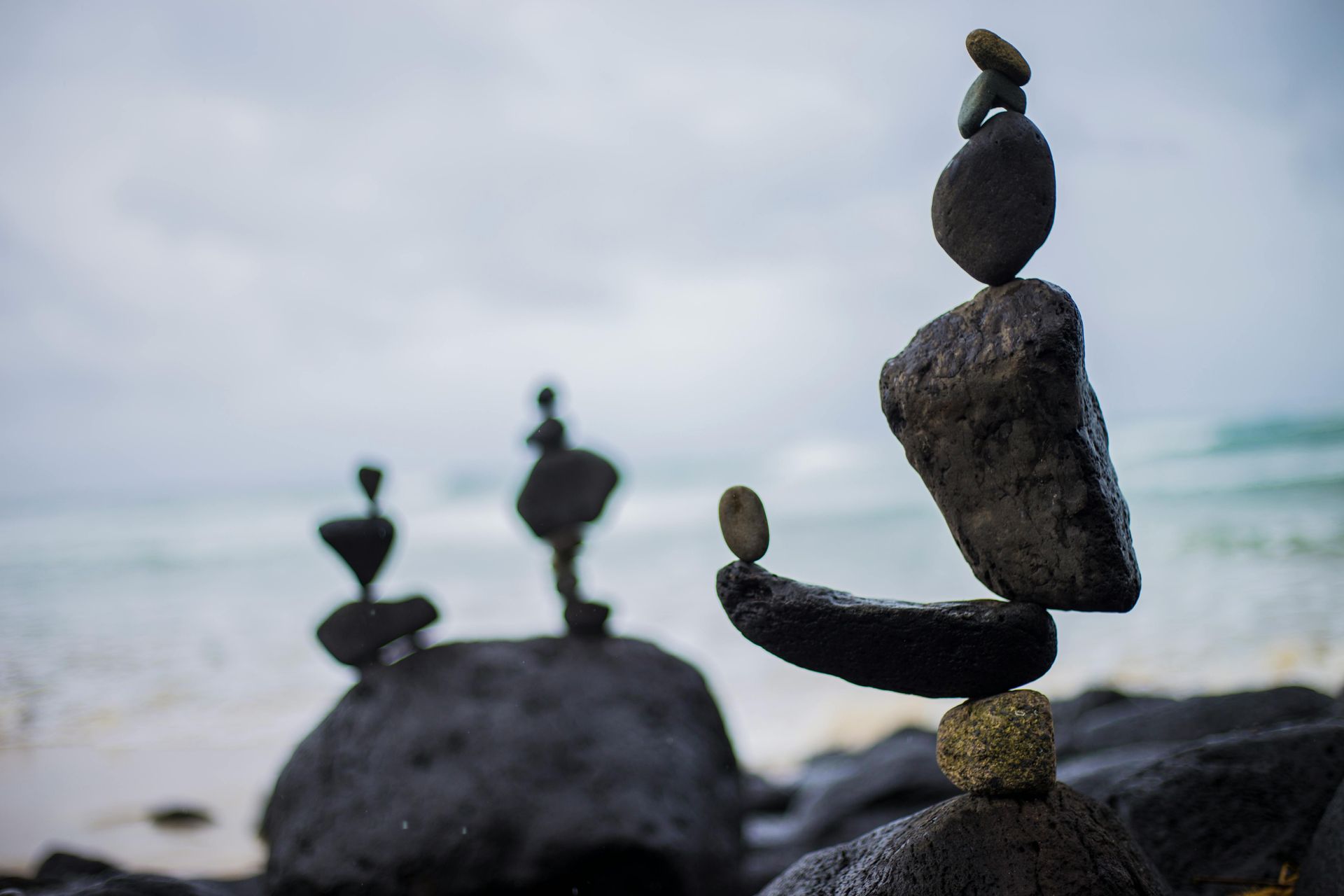 A Group of Rocks Are Stacked on Top of Each Other on a Beach — Angel of Light Nick Turner In Lismore, NSW