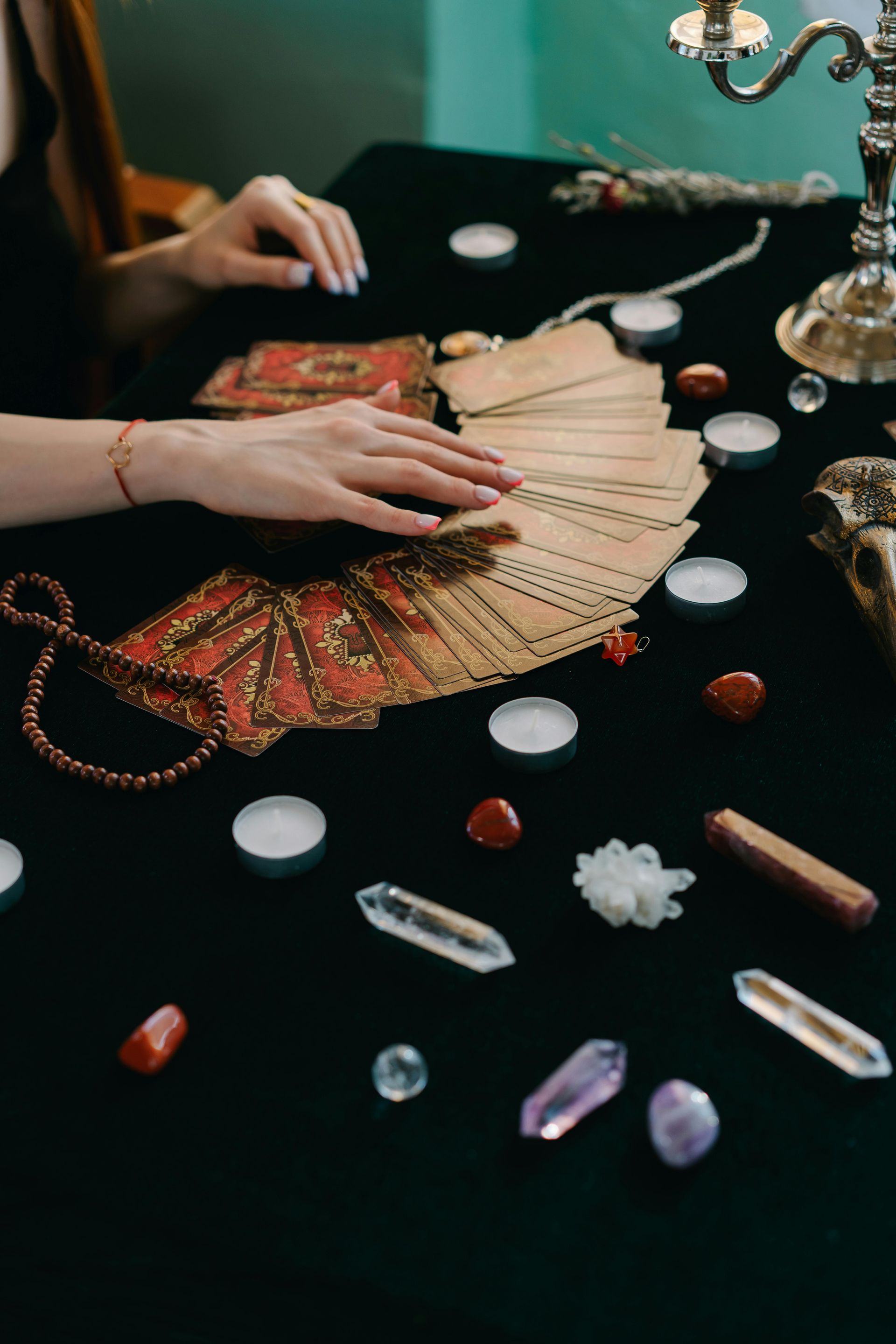 A Woman is Sitting at a Table With Tarot Cards and Crystals — Angel of Light Nick Turner In Lismore, NSW