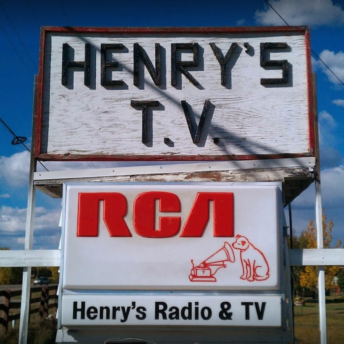 henry's tv radio store sign
