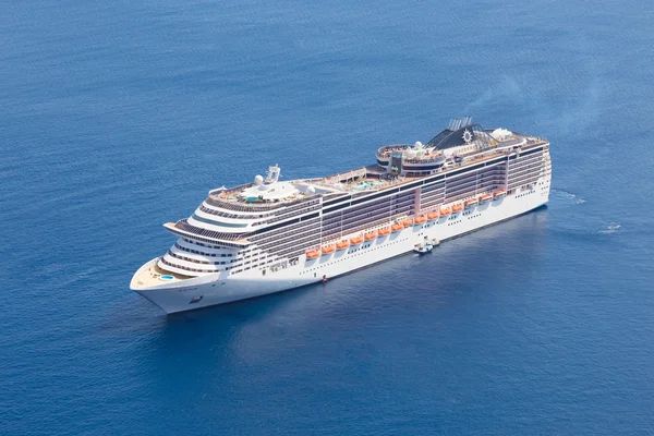 Cruise ship sailing on blue water.