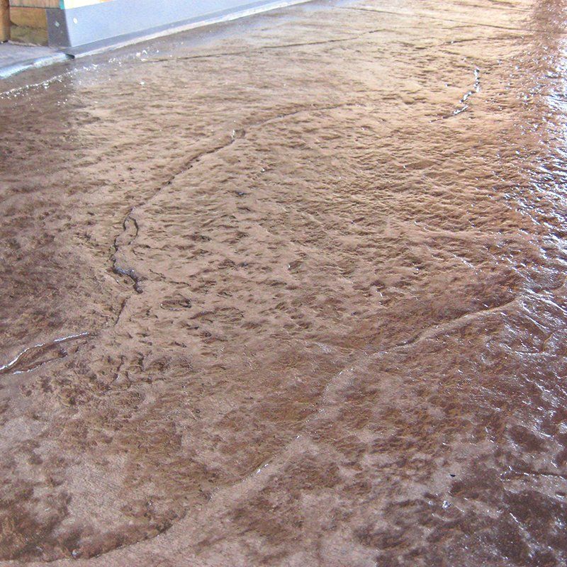 A close up of a concrete floor with a swirl pattern