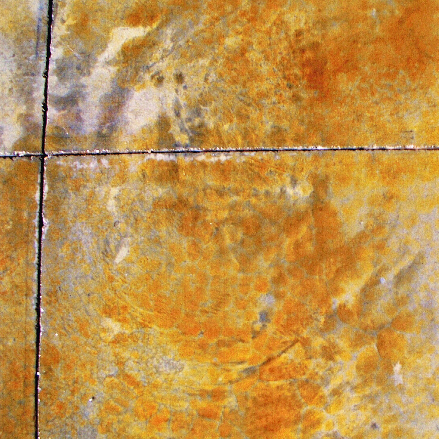 A close up of a tile floor with a marble texture.