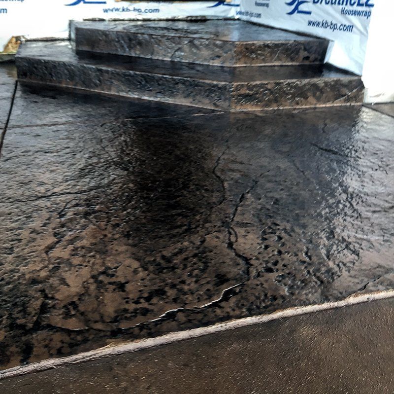 A concrete walkway with steps and a sign that says ' concrete ' on it