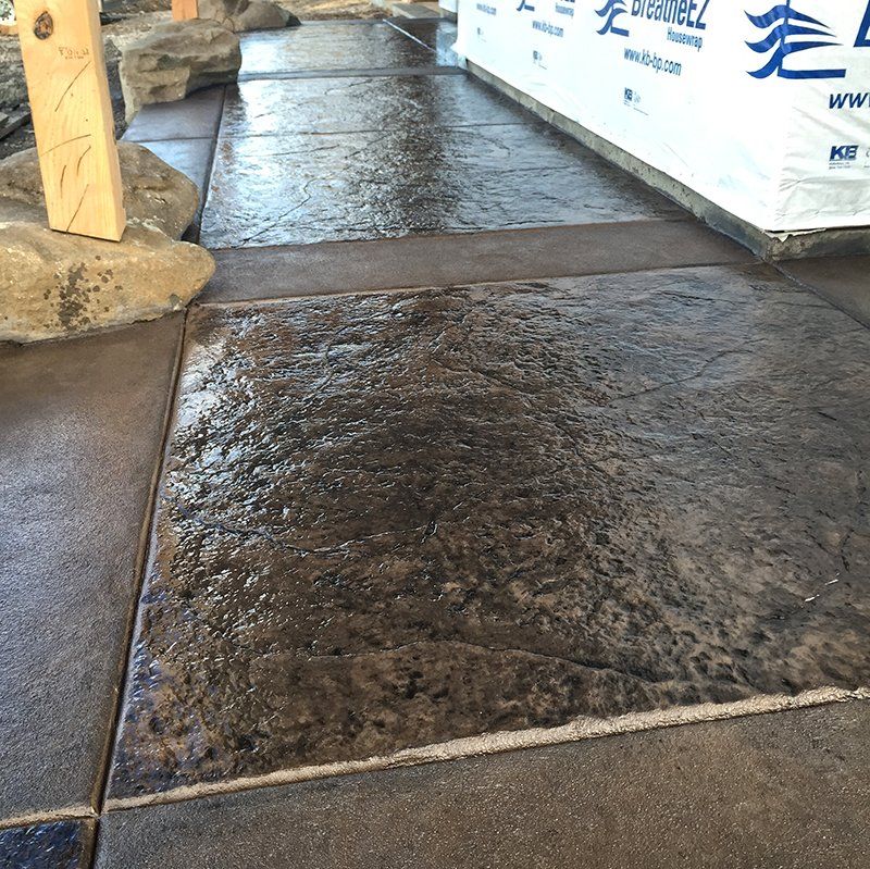 A tiled floor with a box that says drainbel on it