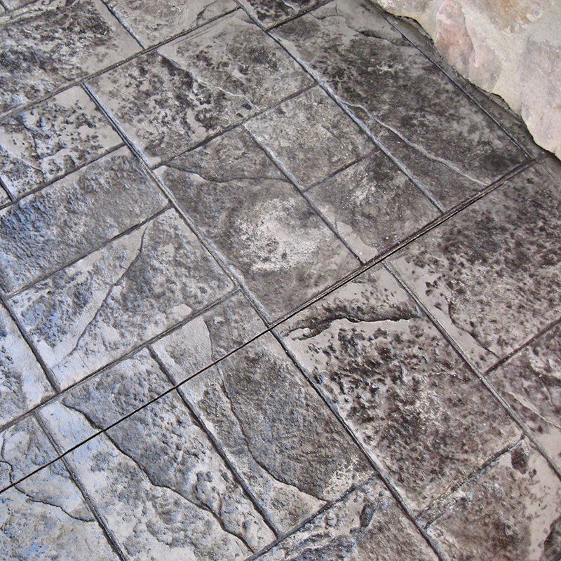 A close up of a gray tile floor