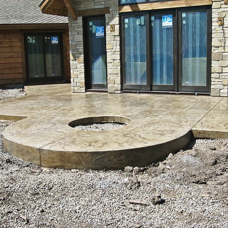A house with a circular patio in front of it