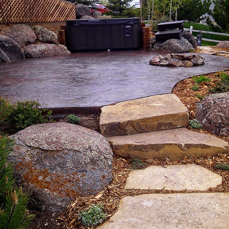 A hot tub is sitting on top of a concrete patio
